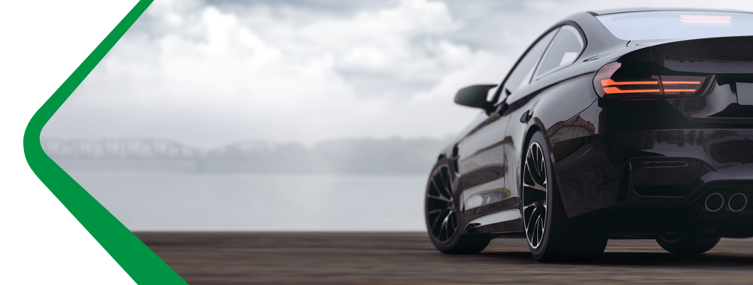 Parked car by a lake under blue sky and clouds, representing Castrol Auto Film partnership opportunities.